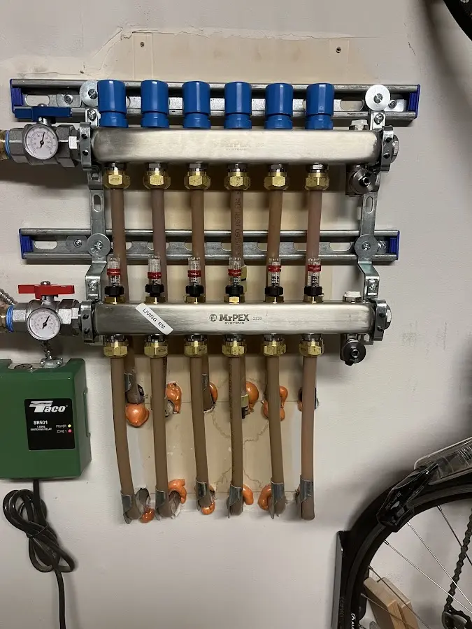 Plumber performing Water Heater Repair at a residential property in Batavia